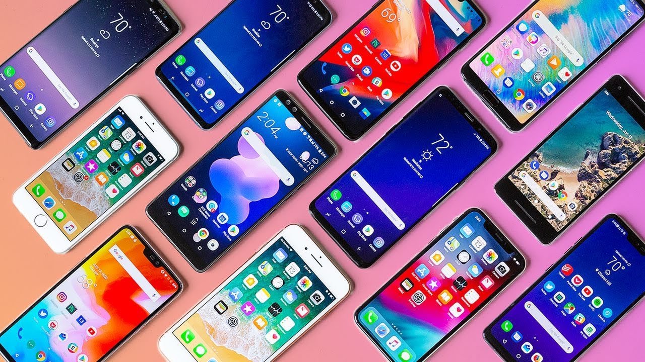Assorted smartphones arranged on a colorful background